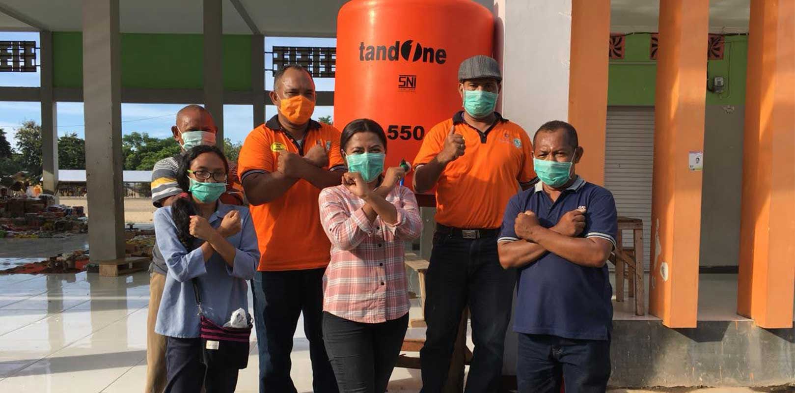 volunteers posing for a photo as part of covid 19 response