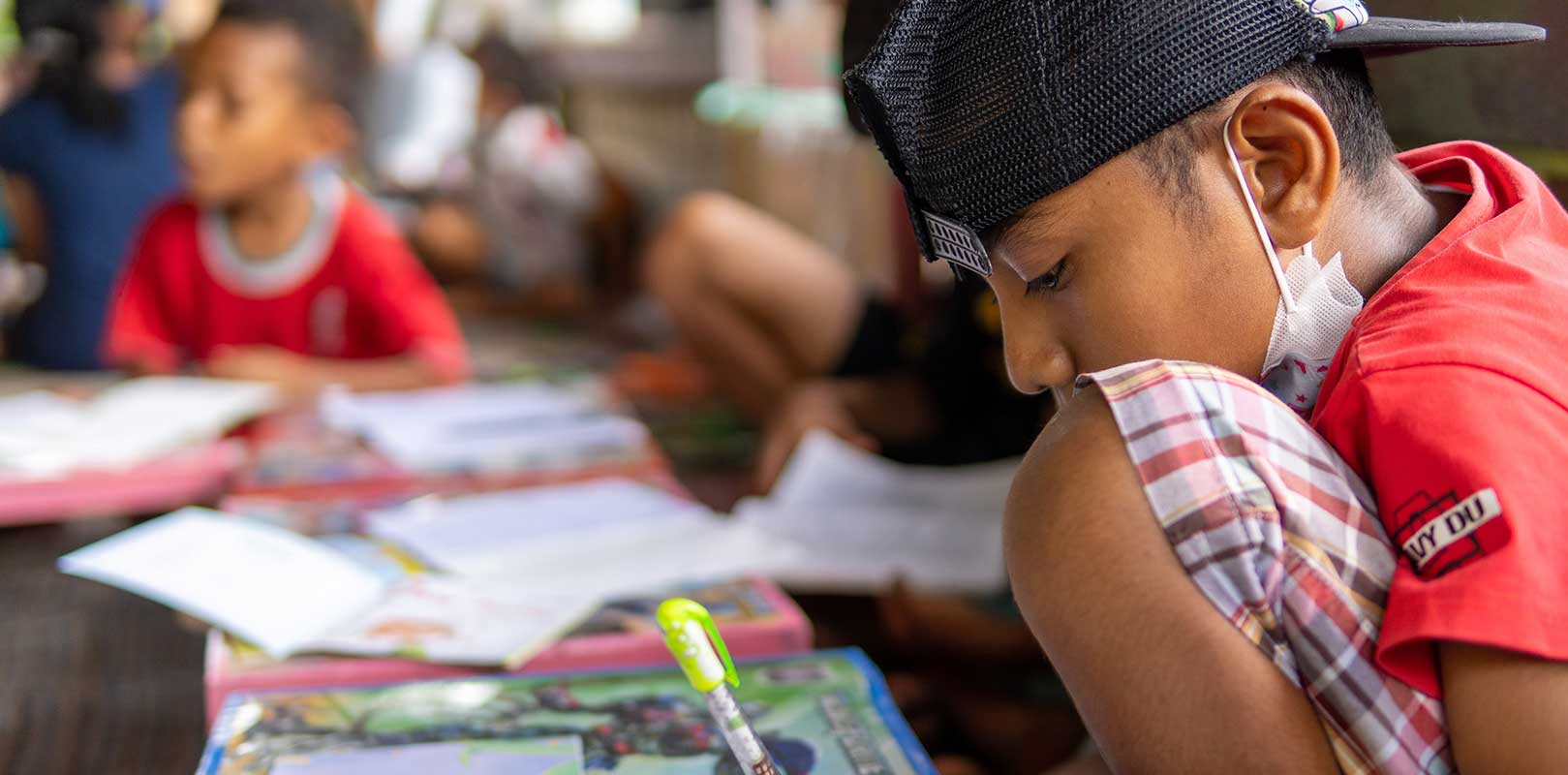 a student reading a book in english club