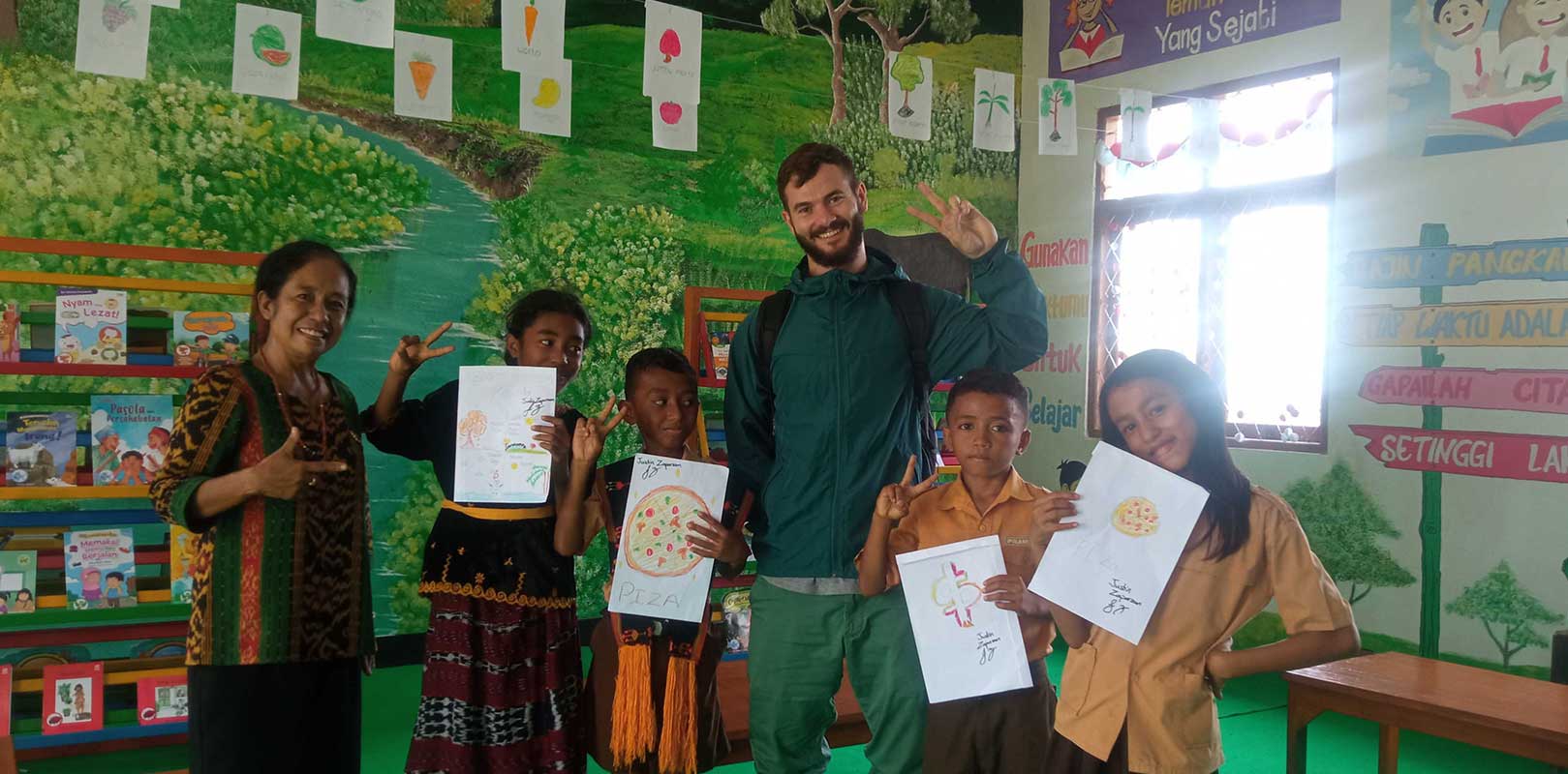 volunteers and students posing for a photo in english club