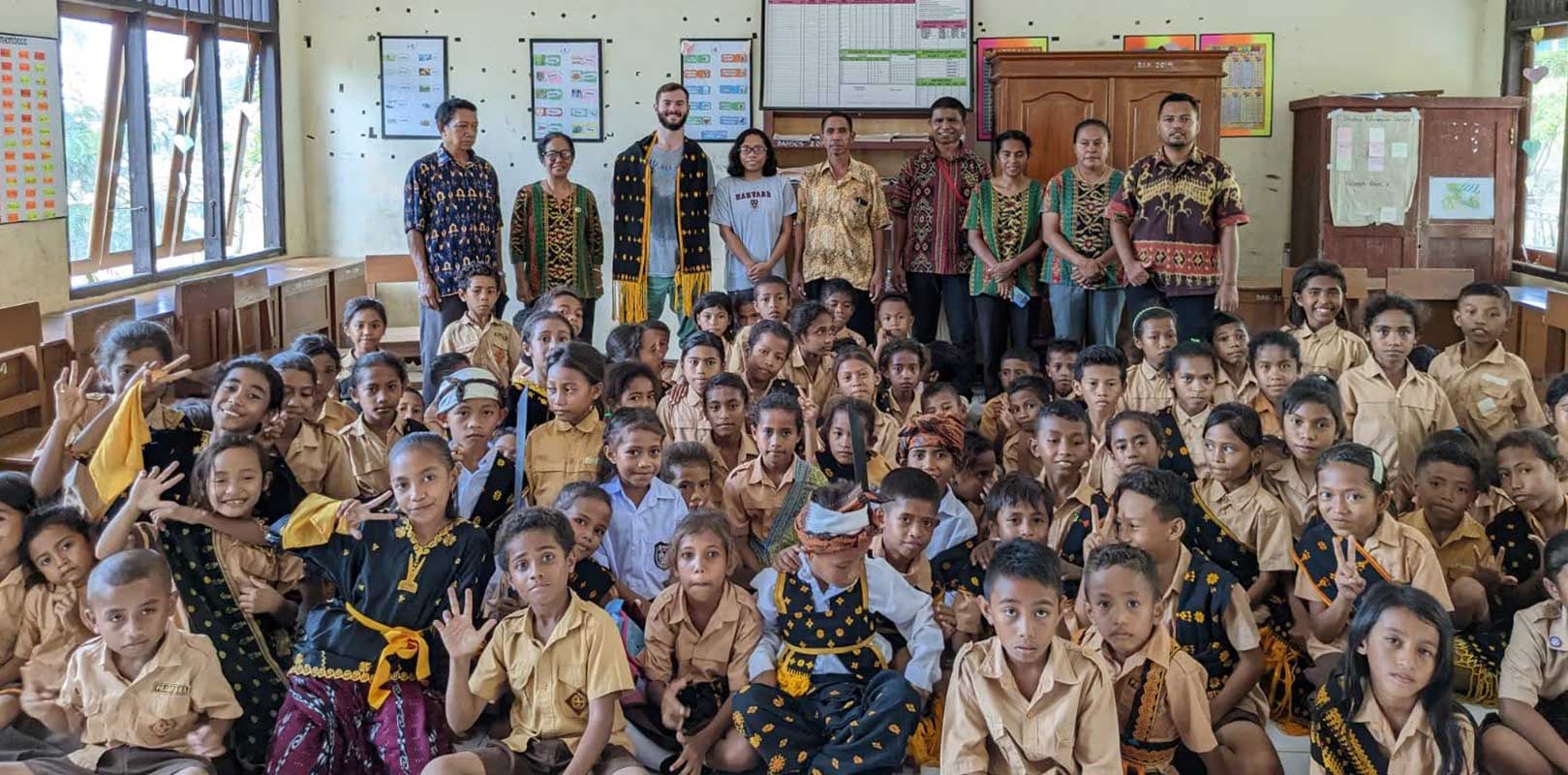 volunteers and students posing for a photo in english club