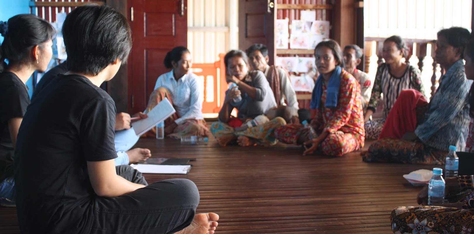 volunteers and beneficiaries of the Phnom Sanitation project discussing about the project