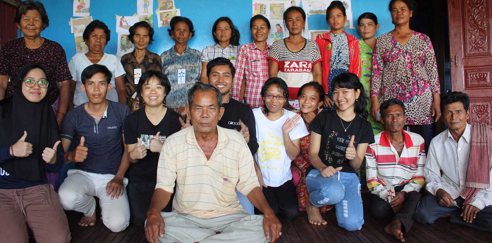 volunteers and beneficiaries posing for a photo