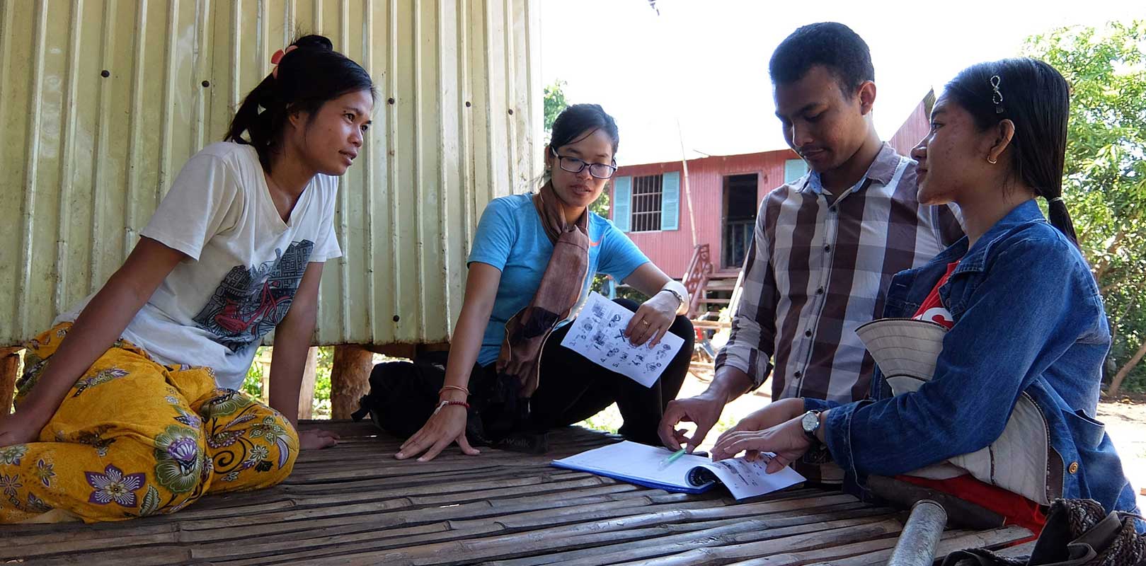 volunteers and beneficiaries of the Phnom Sanitation project discussing about the project
