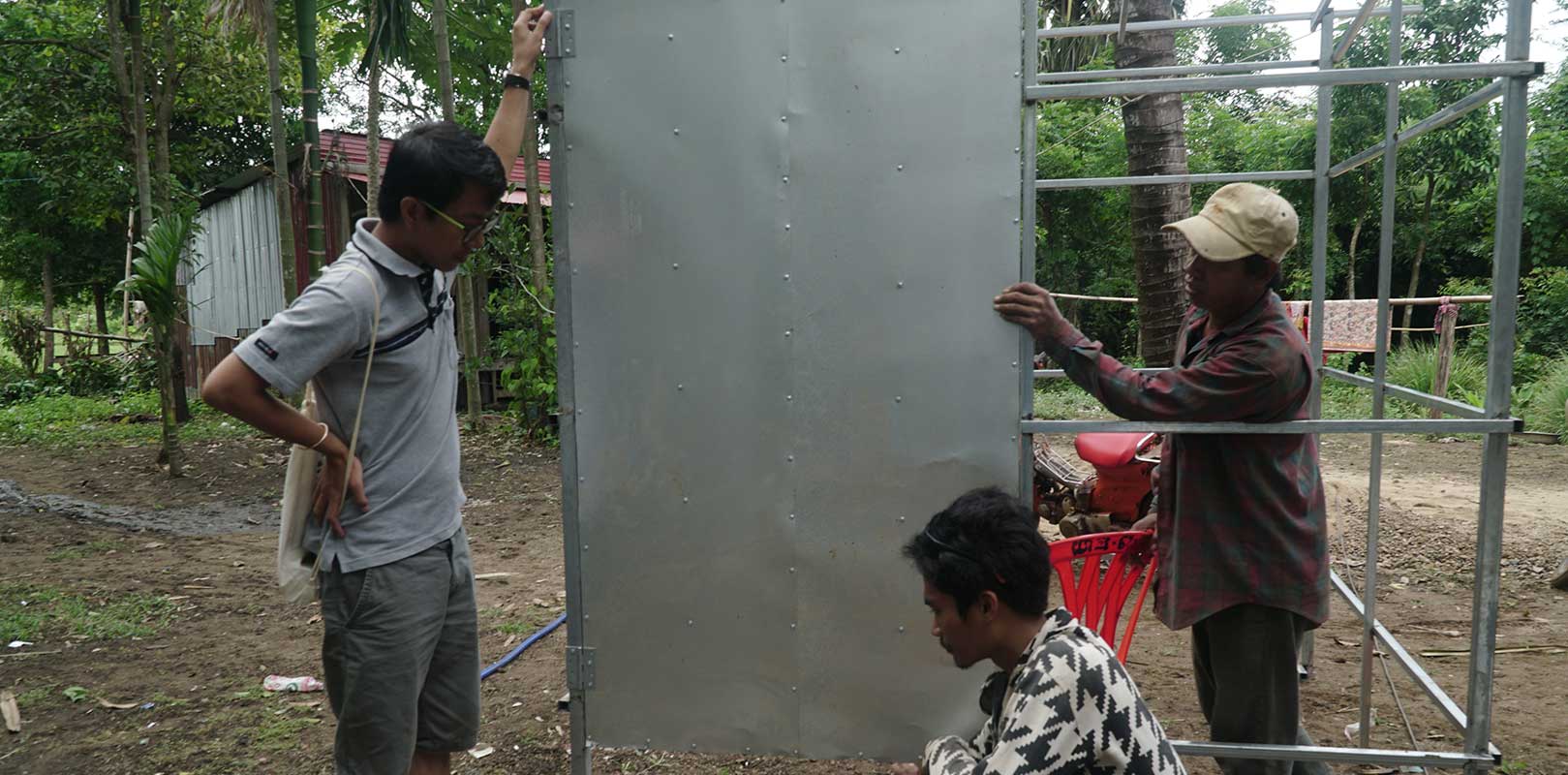volunteers interacting with workers of the toilet