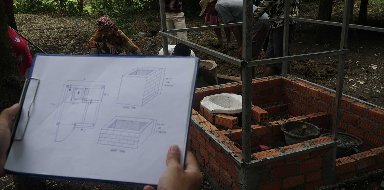 volunteers interacting with workers of the toilet