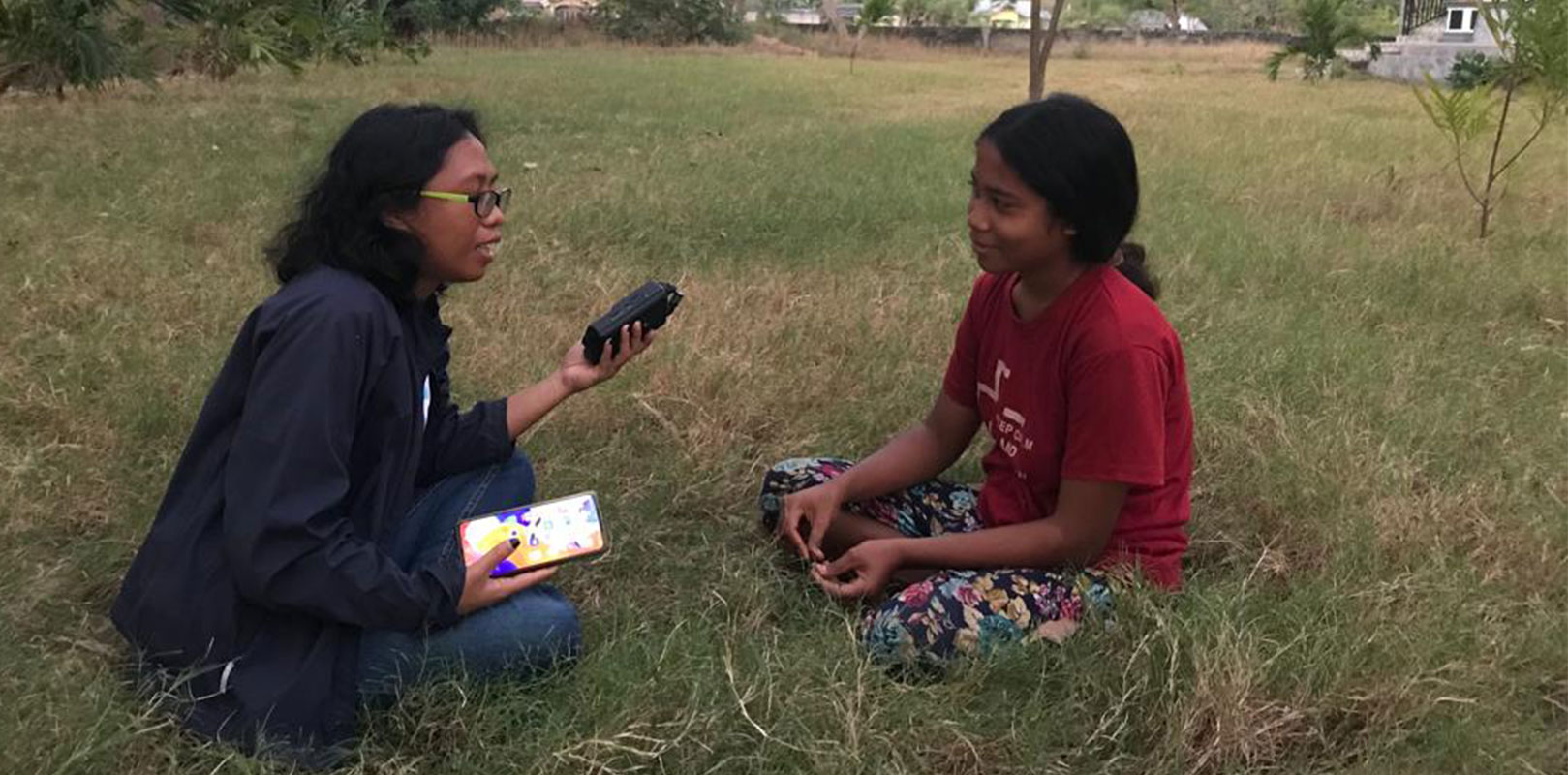 A volunteer talking to a girl
